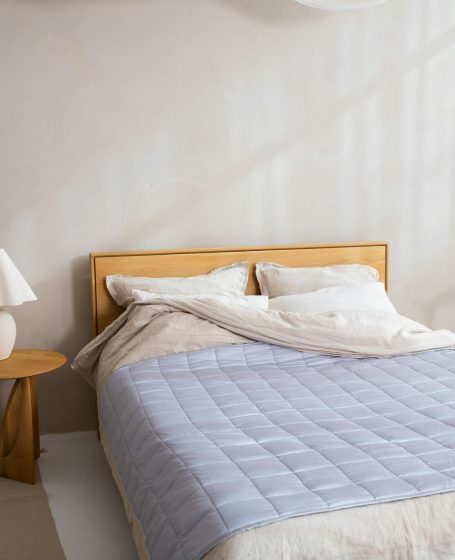 Contemporary bedroom design with wooden furniture and soft natural lighting.